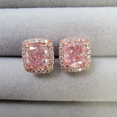 Ethereal pink diamond stud earrings featuring GIA-certified light pink diamonds.