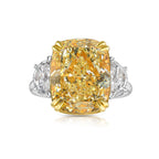 10 carat fancy light yellow diamond cushion cut three stone ring with half moons.