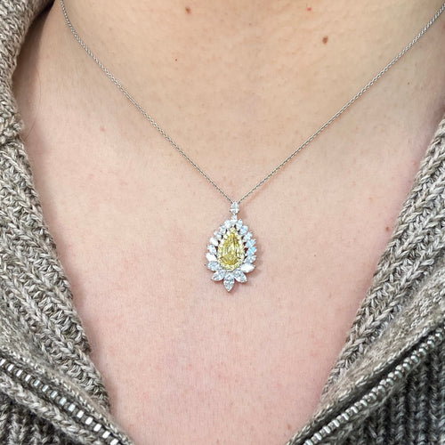Intense yellow pear shape. Gia certified intense yellow diamond. Yellow diamond necklace. Unique yellow diamond necklace. Yellow diamond pear shape necklace.