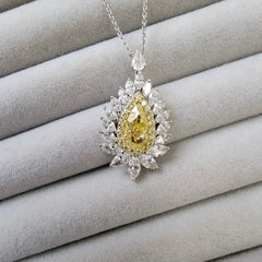 Intense yellow pear shape. Gia certified intense yellow diamond. Yellow diamond necklace. Unique yellow diamond necklace. Yellow diamond pear shape necklace.