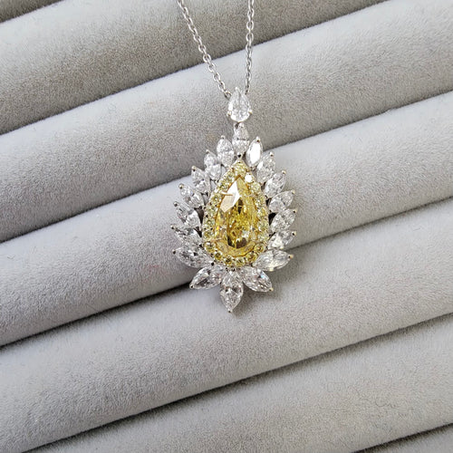Intense yellow pear shape. Gia certified intense yellow diamond. Yellow diamond necklace. Unique yellow diamond necklace. Yellow diamond pear shape necklace.