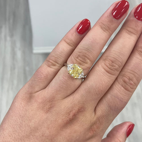 Old Money Radiant Yellow Elongated diamond 3 stone ring.