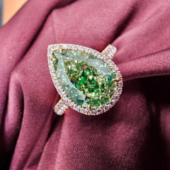 GIA Certified green diamond pear shape ring. Green diamond jewelry. JLO green diamond
