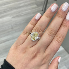 yellow diamond oval ring. yellow diamond halo ring. 4 carat yellow ring. oval yellow diamond. yellow diamond oval shape.