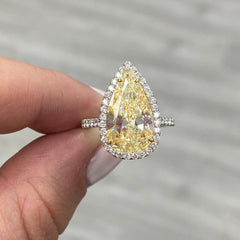 yellow pear shape diamond ring. yellow diamond pear shape. yellow pear shape halo ring. yellow diamond pear. yellow diamond ring.