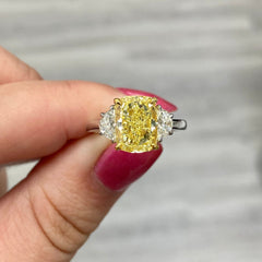 Fancy yellow diamond ring. Fancy yellow cushion cut diamond. Canary yellow diamond ring. Yellow diamond engagement ring. Canary engagement ring. Big yellow diamond ring. Gia certified yellow diamond ring.