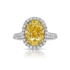 Fancy yellow diamond ring. yellow diamond oval ring. yellow diamond halo ring.