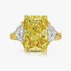 5 carat fancy light yellow elongated radiant cut diamond ring in yellow gold
