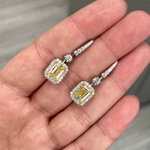 Yellow diamond studs. Yellow diamond earrings. Cushion cut diamond earrings. Yellow diamond earrings. Canary yellow diamond earrings. yellow diamond emerald cut.