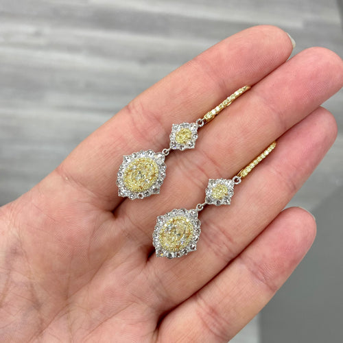 yellow diamond earring. yellow diamond. fancy yellow diamond. diamond earrings. yellow diamond halo earring. canary diamond ring. yellow diamond jewelry. GIA certified yellow diamond.