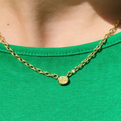 Canary diamond necklace, yellow pear shape diamond on a golden chain, bezel set yellow diamondCanary diamond necklace, yellow oval cut diamond on a golden chain, bezel set yellow diamond