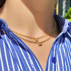 Canary diamond necklace, yellow oval cut diamond on a golden chain, bezel set yellow diamond