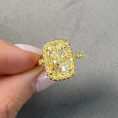 GIA certified light yellow elongated cushion cut diamond ring with canary yellow and golden yellow diamonds, SI1 clarity.