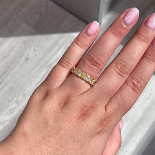 Alternating yellow and white diamond eternity band. Elongated radiant cut. Long radiant cut. Fancy yellow long radiants. Long white diamond radiants. Eternity band. Yellow diamond eternity band. Yellow diamond ring.