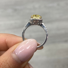 Yellow diamond ring with white halo diamonds