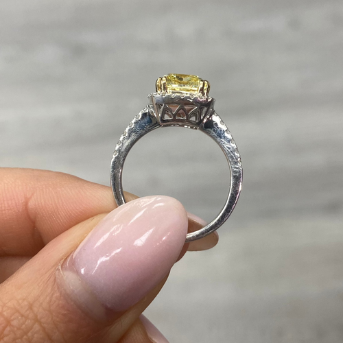 Yellow diamond ring with white halo diamonds