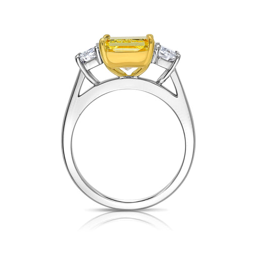 GIA certified fancy yellow elongated radiant diamond engagement ring with a striking center with a VVS2 clarity.