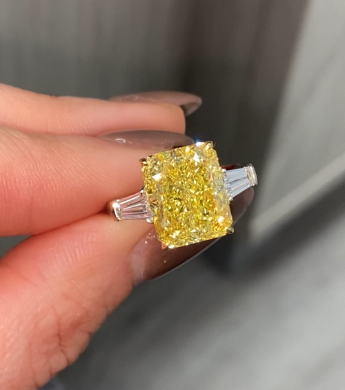 Luxurious yellow elongated radiant diamond engagement ring with a stunning hue with a VVS2 clarity.
