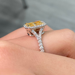 Old money yellow diamond ring with White Halo diamonds with a VS2 clarity.