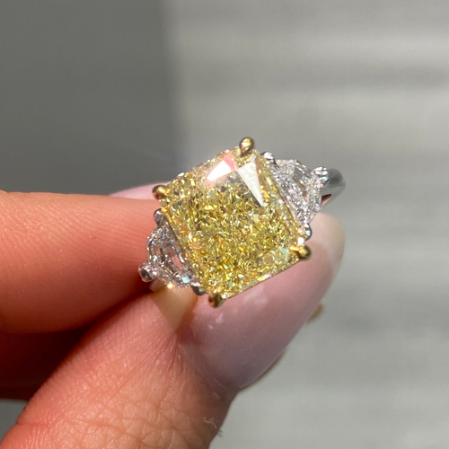 Fine Yellow diamond engagement ring featuring a GIA certified diamond.