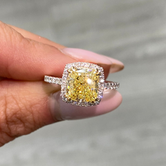 Yellow diamond ring with white halo diamonds