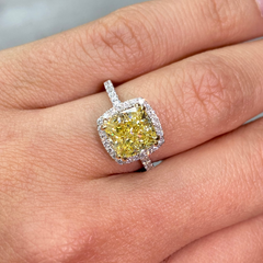Yellow diamond ring with white halo diamonds
