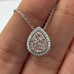 Ethereal pink pear-shaped diamond pendant with double halo featuring a GIA-certified faint pink center diamond with a VS2 clarity.
