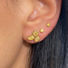 Celebrity style unique earrings with pear, radiant, and oval cut diamonds.