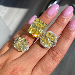 13.30 carat yellow diamond on the center with white surrounding diamonds