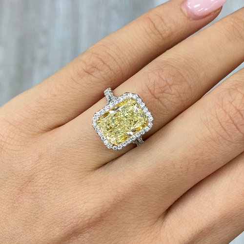 Elongated yellow diamond ring with white diamonds