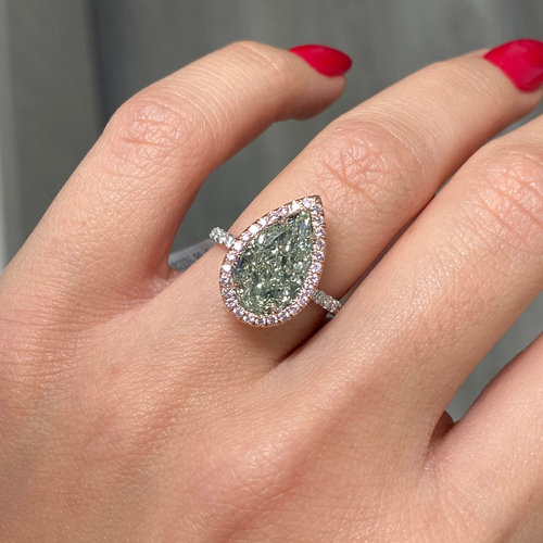 GIA certified fancy pear shaped green ring with pink diamonds.