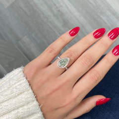 GIA certified fancy pear shaped green ring with pink diamonds.