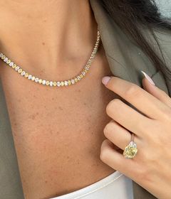 Ring Necklace with yellow and white oval diamonds worn by female