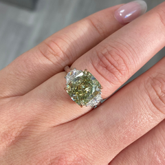 Fancy Yellow-Green cushion cut diamond engagement ring with VS2 clarity and a unique hue.