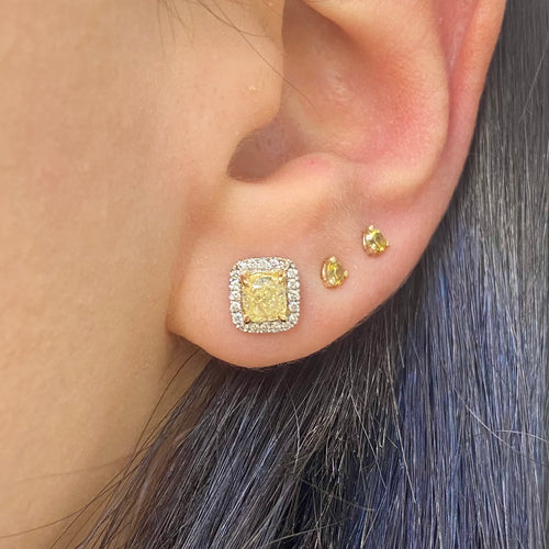 Fancy Light Yellow Cushion Diamond Studs 1.42 carat total center diamonds Center diamonds are 0.71ct each Surrounded by 0.22 Carats of White Radiant Diamonds Set in 18k Gold Handmade in NYC