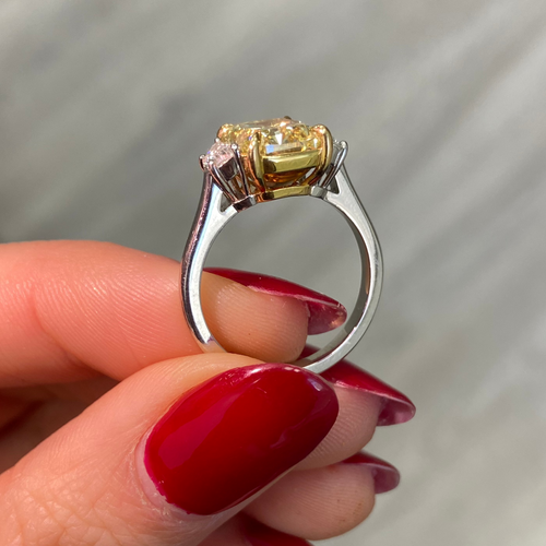 Yellow diamond engagement ring
elongated cushion cut yellow diamond three stone engagement ring