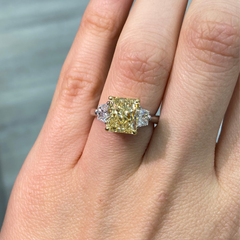 Fancy yellow engagement ring, three stone diamond ring, yellow diamond ring, yellow radiant diamond.