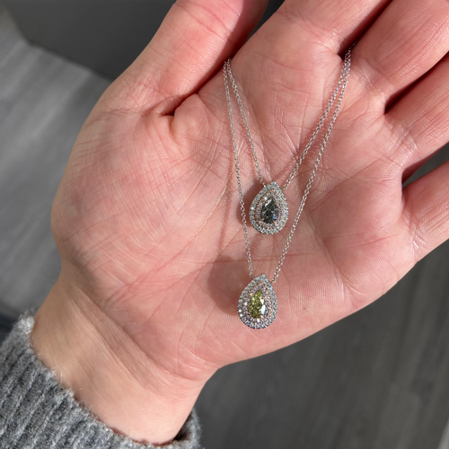 Elegant greenish yellow pear-shaped diamond pendant with a double halo design and unique charm with a SI2 clarity.