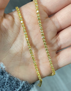 Fancy round shaped intense yellow diamond tennis bracelet, GIA certified with VS clarity.