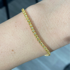 Fancy round shaped intense yellow diamond tennis bracelet, GIA certified with VS clarity.