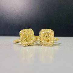 2.28 Carat Center Diamond GIA Light Yellow Diamond (Y-Z) Radiant Cut Diamond  0.30 Carats of Fancy Yellow Rounds  VS1 Clarity  Medium Blue Fluorescence Excellent, Very Good cutting Set in 18k Yellow Gold  GIA Certified Diamond Handmade in NYC