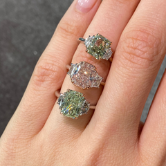 GIA-certified greenish yellow diamond ring with a radiant cut center stone and VVS2 clarity.