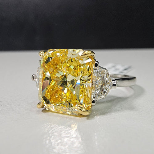 6.57 Carat Center Diamond GIA Fancy Intense Yellow Radiant Cut Diamond SI1 Clarity Excellent, Good Cutting 0.71 Carat E VS1 Epaulettes Handmade in NYC Set in 18k & Platinum