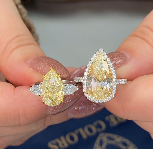 yellow pear shape diamond ring. yellow diamond pear shape. yellow pear shape halo ring. yellow diamond pear. yellow diamond ring.