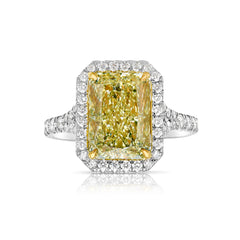 Light yellow radiant cut diamond engagement ring with a white diamond halo, VS2 clarity.