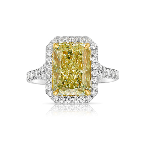 Light yellow radiant cut diamond engagement ring with a white diamond halo, VS2 clarity.