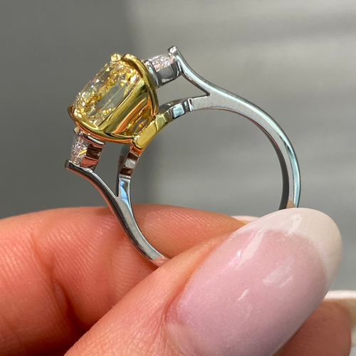 Fine Yellow diamond engagement ring featuring a GIA certified diamond.