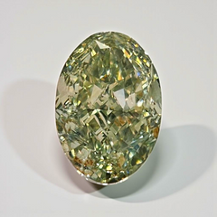 Oval-shaped green diamond on a light gray background
