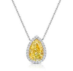 Pear shape yellow diamond with white halo diamonds and a VVS2 clarity.