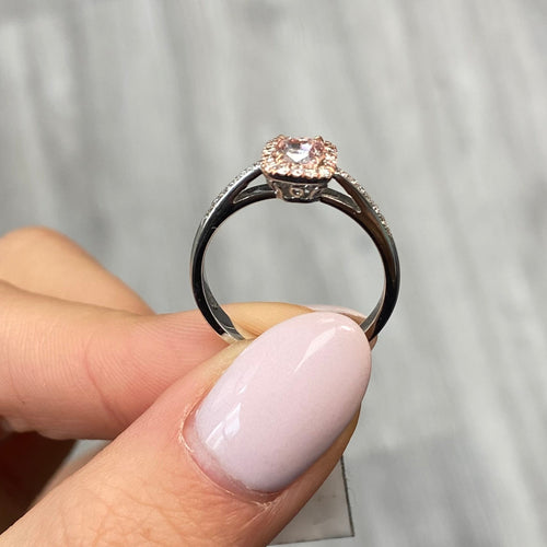 Pink diamond ring. pink diamond engagement ring. light pink diamonds. light pink cushions. diamond ring.